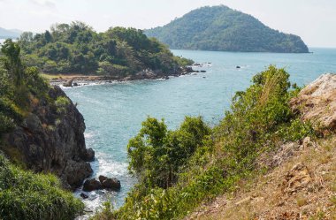 Beautiful view point of tropical sea and island with mountain cliff and rocks in Noen Nangphaya View Point in Chanthaburi, Thailand.