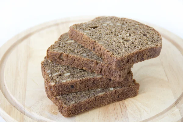 Black bread with sunflower seeds — Stock Photo, Image