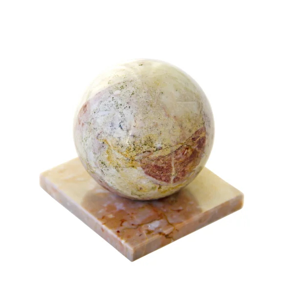 Bola de pedra em um fundo branco — Fotografia de Stock