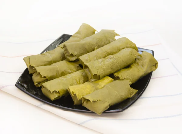 Cabbage rolls in vine leaves — Stock Photo, Image