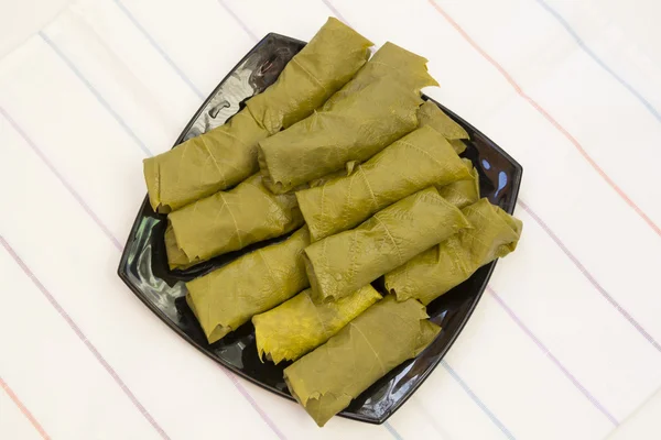 Cabbage rolls in vine leaves — Stock Photo, Image