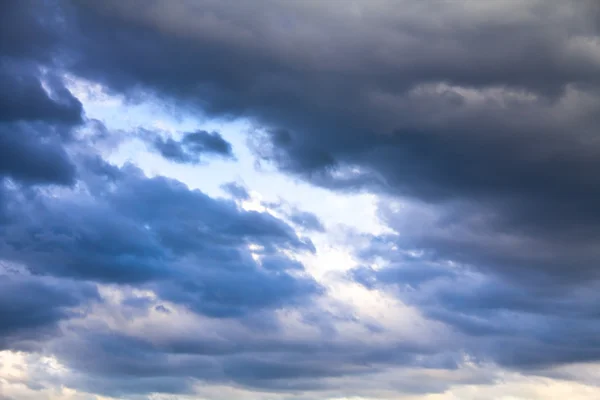 Dramatic sky with clouds and clean fragment Stock Picture