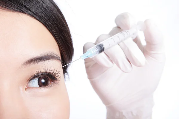 Close up of Young woman get a injection — Stock Photo, Image