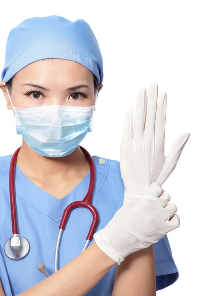 Woman doctor wearing medical gloves — Stock Photo, Image