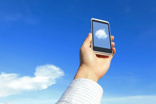 Business man holding mobile phone with cloud — Stock Photo, Image