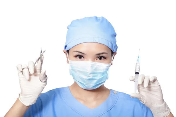 Surgeon woman holding syringe and clippers — Stock Photo, Image