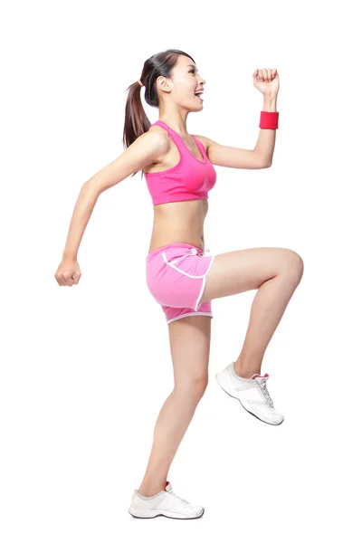 Sport woman stretches her leg — Stock Photo, Image