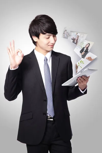 Business man show ok and using tablet pc — Stock Photo, Image