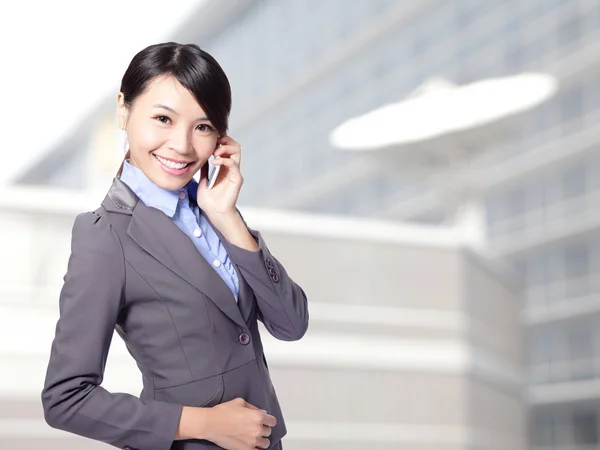 Business woman speaking mobile phone — Stock Photo, Image