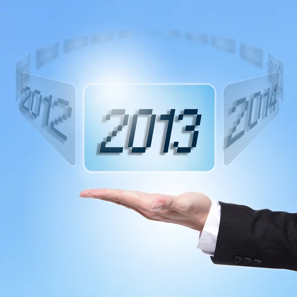 Business man holding screen with 2013 — Stock Photo, Image