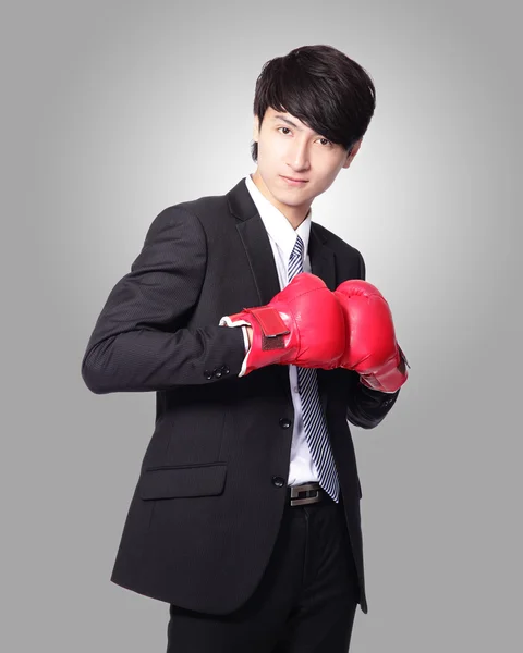 Businessman smile with boxing gloves — Stock Photo, Image