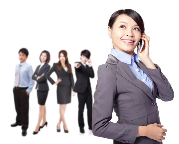 Young pretty asian woman on the phone with team — Stock Photo, Image