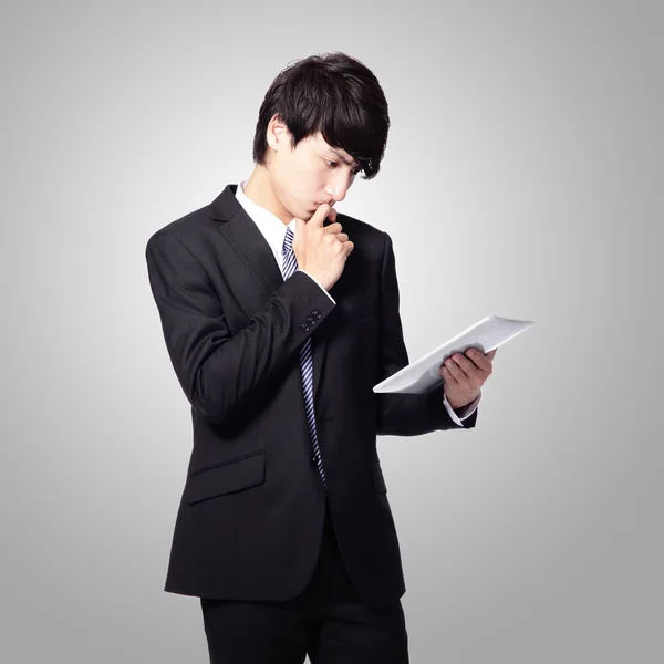 Business man reading news on tablet pad — Stock Photo, Image