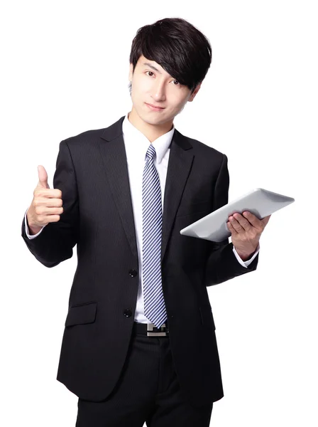 Young business man thumb up with touch pad Stock Photo