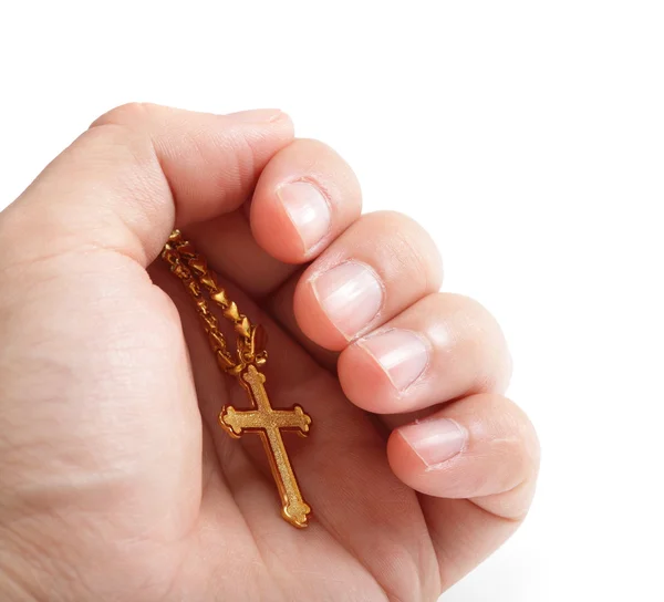 Рука тримає золотий хрест намисто — стокове фото