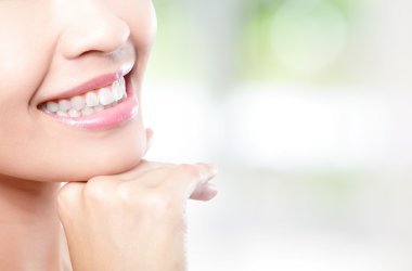 Beautiful young woman teeth close up clipart