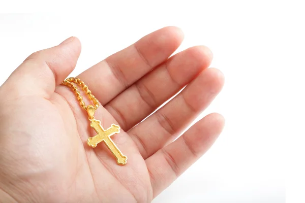 Hand hold golden cross necklace — Stock Photo, Image