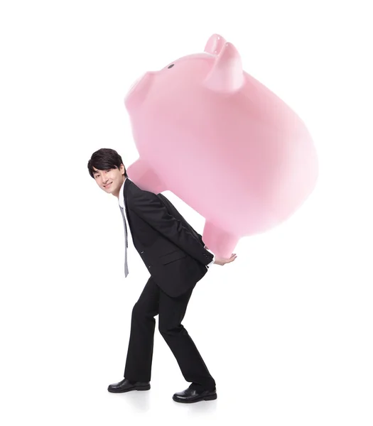 快乐商务男子携带粉红猪存钱罐 — 图库照片