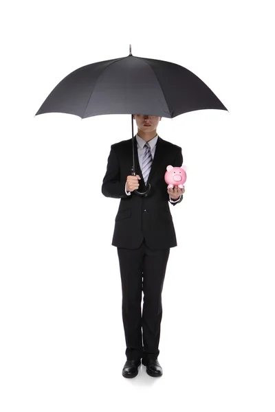 Uomo d'affari con ombrello e salvadanaio — Foto Stock