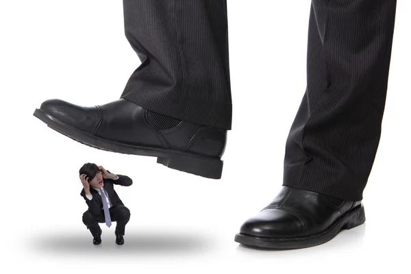 Business man steping op een angst-man — Stockfoto