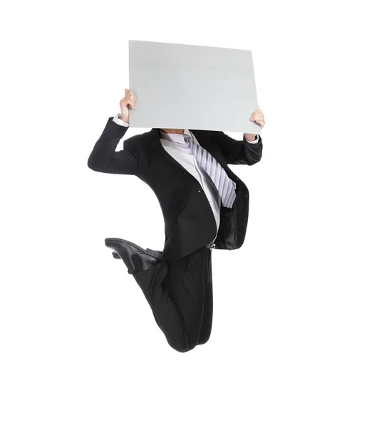 Homme d'affaires sautant et tenant panneau d'affichage — Photo