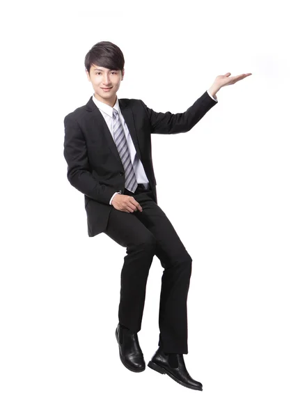 Business man sitting on some thing and show copy space — Stock Photo, Image