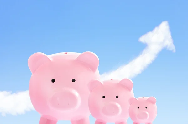 Pink piggy banks with sky and cloud arrow — Stock Photo, Image