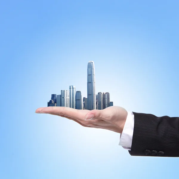 Man holding a city in hand — Stock Photo, Image