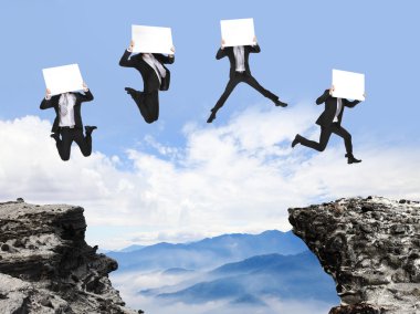 businessman jumping with billboard on the mountain clipart