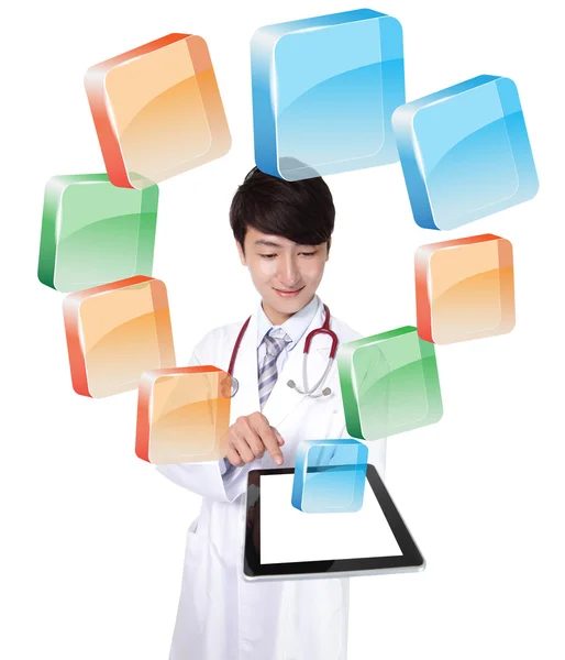 Doctor using tablet pc with colorful icon — Stock Photo, Image