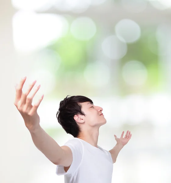 Young man carefree outstretched arms — Stock Photo, Image