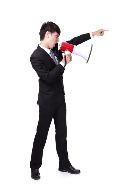 Business man shouting into a megaphone — Stock Photo, Image