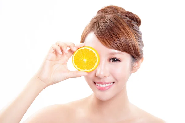 Beautiful woman face with juicy orange — Stock Photo, Image