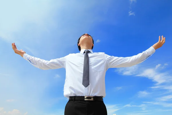 Carefree business man arms up — Stock Photo, Image