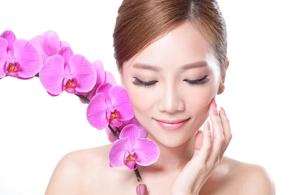 Face with pink orchids — Stock Photo, Image