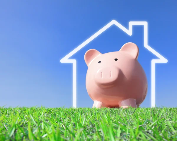 Pink piggy bank with new home house imagination — Stock Photo, Image