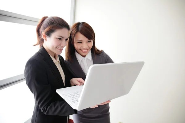 Business women look and smile conversation — Stock Photo, Image