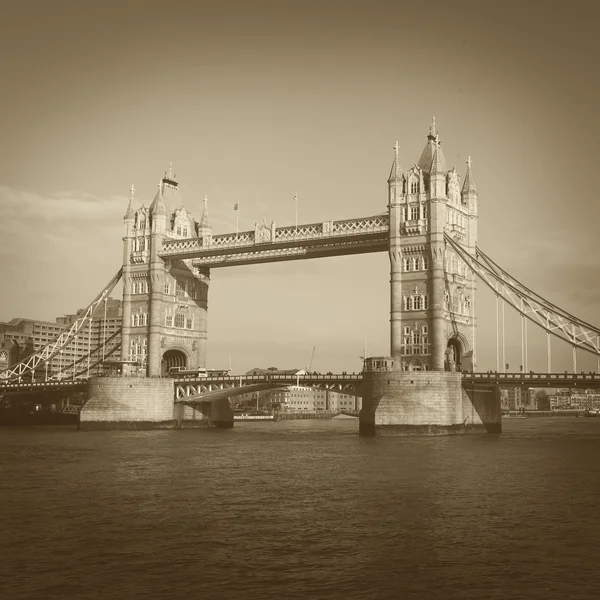 Famous London tower bridge on Thames river in square sepia vintage style — Stock Photo, Image