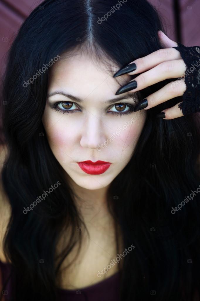 Closeup Portrait Of A Beautiful Gothic Girl With Red Lips