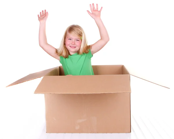 Meisje popping out of box — Stockfoto
