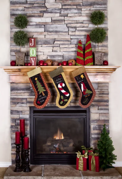 Christmas stockings hanging from a mantel or fireplace — Stock Photo, Image