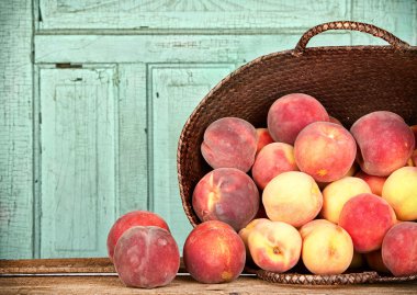 Many peaches in basket clipart