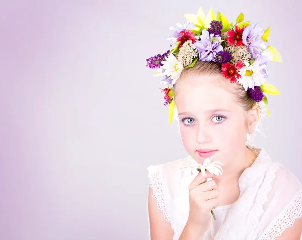 Girl or teen with flowers in hair — Stock Photo, Image