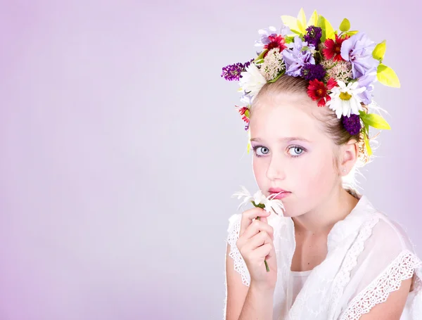 Girl or teen with flowers in hair — Stock Photo, Image