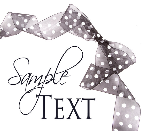 Black polka dot ribbon and bow isolated