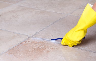 Cleaning tile grout with toothbrush clipart