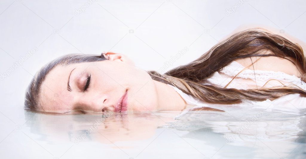 Woman in water with reflection