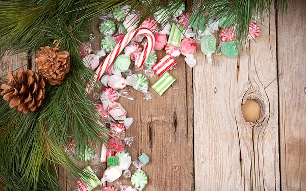 Christmas candy on wooden background — Stock Photo, Image