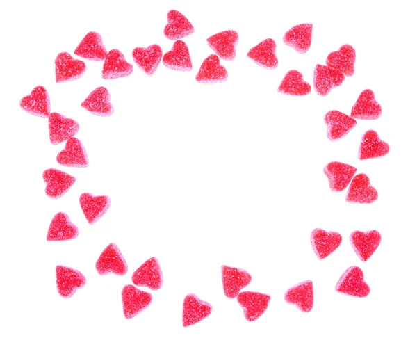 Herzförmige Bonbons auf Weiß — Stockfoto