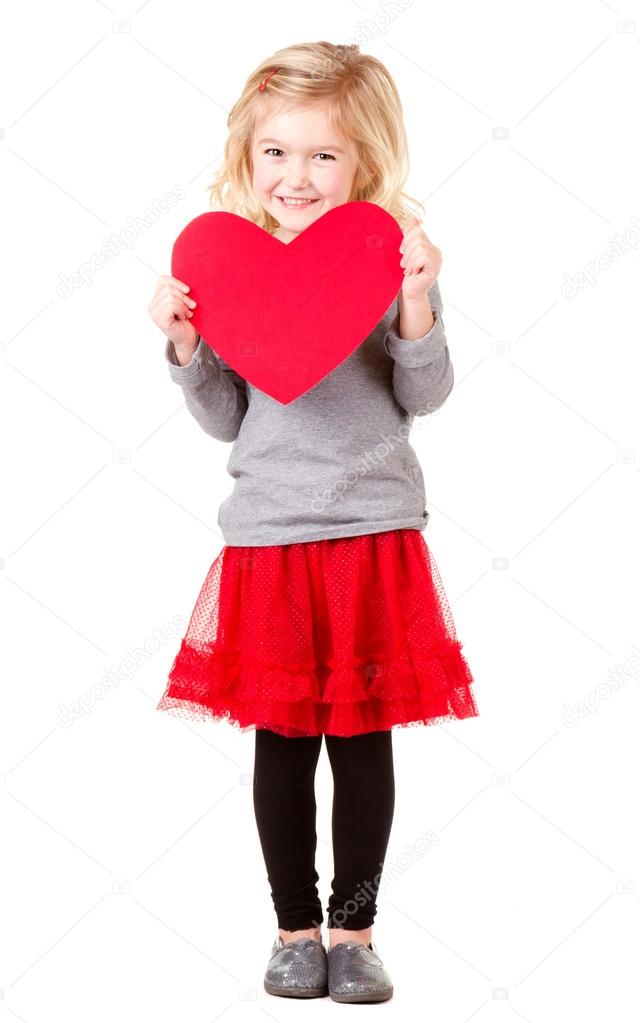 Little girl holding heart